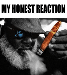 a man with a beard is smoking a cigar with the words my honest reaction behind him