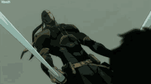 a man in a black suit is holding two swords and a xcomgif is below him