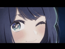 a close up of a girl 's face with a blue star in her eye