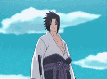 a man in a kimono is standing in front of a blue sky with clouds .