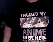 a person wearing a t-shirt that says " i paused my anime to be here "