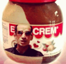 a jar of e crem peanut butter has a picture of a man on it