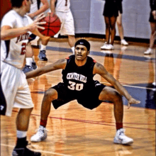 a basketball player wearing a center hill 30 jersey