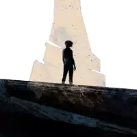 a silhouette of a person standing in front of a tower