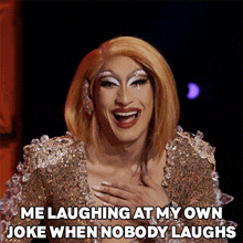 a drag queen is laughing at her own joke