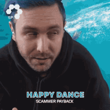 a man wearing a black hoodie says happy dance scammer payback