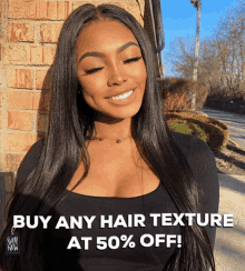 a woman is smiling in front of a brick wall with the words buy any hair texture at 50 % off below her