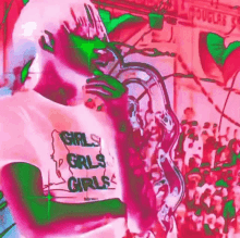 a woman wearing a pink and green shirt with the words `` girls girls girls '' on it .