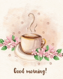 a cup of coffee on a saucer with pink flowers and the words `` good morning '' written on it .