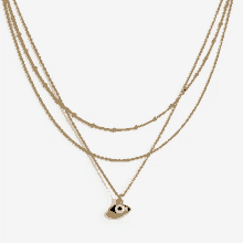 a necklace with a blue evil eye pendant