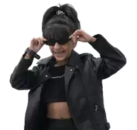 a girl wearing sunglasses and a leather jacket is smiling .