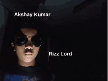 a young man wearing sunglasses with akshay kumar and rizz lord written below him