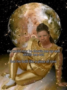 a man in a gold outfit is sitting in front of a planet with a caption that says the world may be chewin me up