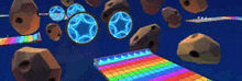 a rainbow colored carpet is surrounded by rocks and balls