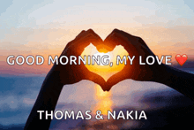 a couple of hands making a heart shape with the words good morning my love