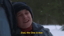 a young boy is crying in the snow and saying `` dad , the one is real . ''