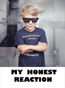 a boy wearing sunglasses and a shirt that says " my honest reaction " stands with his arms crossed