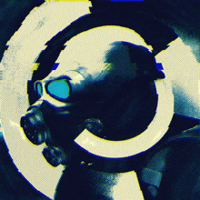 a man wearing a gas mask and goggles is surrounded by a yellow circle