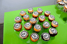 a bunch of cupcakes with cc on them