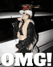 a woman smoking a cigarette in front of a white limousine that says omg on it