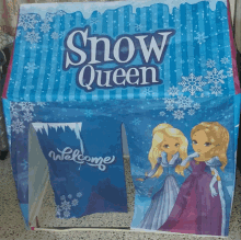 a blue and purple snow queen tent with a welcome sign