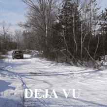 a car is driving down a snowy road with deja vu written in white letters