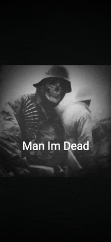 a black and white photo of a soldier with a skull on his face and the caption man im dead