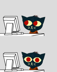 a black cat with red eyes is sitting in front of a computer monitor