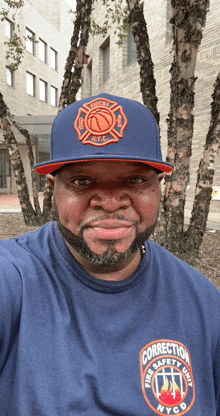 a man wearing a hat that says nyc fire department