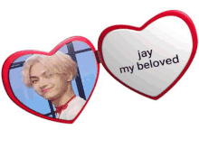 a heart shaped mirror that says jay my beloved on it