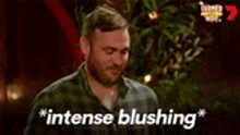 a man with a beard is saying `` intense blushing '' .