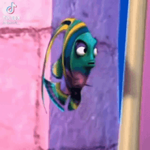 a fish from the movie finding nemo is looking out of a doorway .