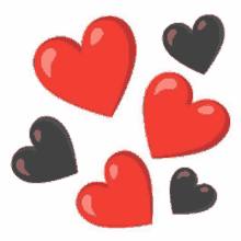 a bunch of red and black hearts are stacked on top of each other on a white background .