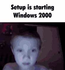 a picture of a child with the words setup is starting windows 2000 on the bottom