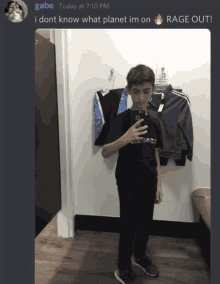 a boy taking a picture of himself in a dressing room with a caption that says gabe today at 7:10 pm