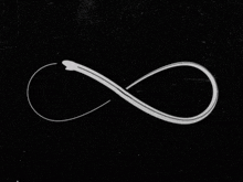 a black background with a white infinity symbol