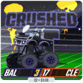 a monster truck is crushed by bal and cle in a football game