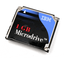 a 1 gb microdrive from ibm sits on a white background