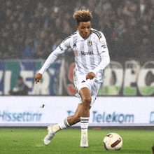 a soccer player wearing a white jersey that says rain