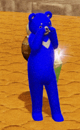 a blue teddy bear with a bag on its back is standing on a sandy surface