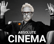 a poster for absolute cinema features a man with glasses and a superman pin