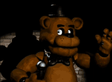 a brown teddy bear wearing a top hat and bow tie holds a microphone