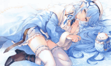 a girl with long blue hair is laying on the snow