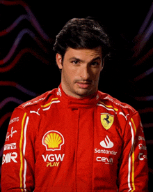 a man wearing a red ferrari racing suit with sponsors such as vgw and santander on the sleeves