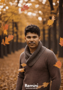 a man in a brown sweater stands in a forest with leaves falling from the trees