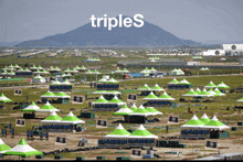 a large field of tents with the word triples on the bottom