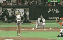 a woman in high heels is throwing the first pitch on a baseball field .