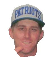 a man wearing a patriots hat is making a face