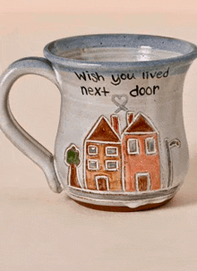 a mug that says " wish you lived next door " on it