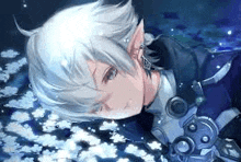 a boy with white hair and elf ears is laying on the ground with flowers in the background .